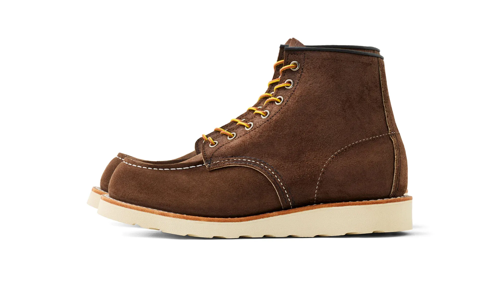 Chocolate brown suede moc toe boot with tan laces and a cream wedge sole