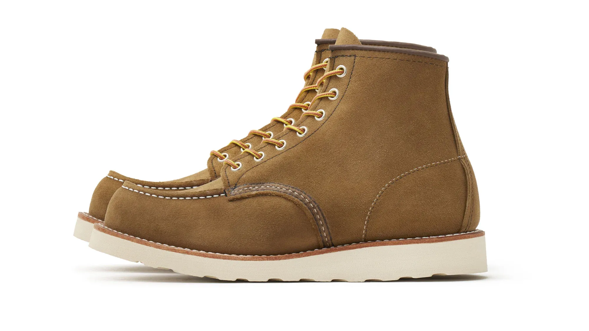 Olive suede moc toe boot with tan laces and a cream wedge sole