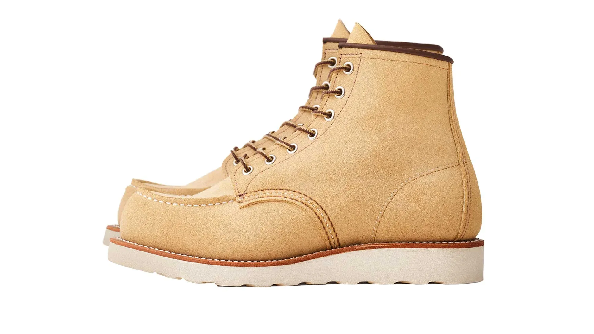 Sand roughout suede moc toe boot with brown laces and a cream wedge sole
