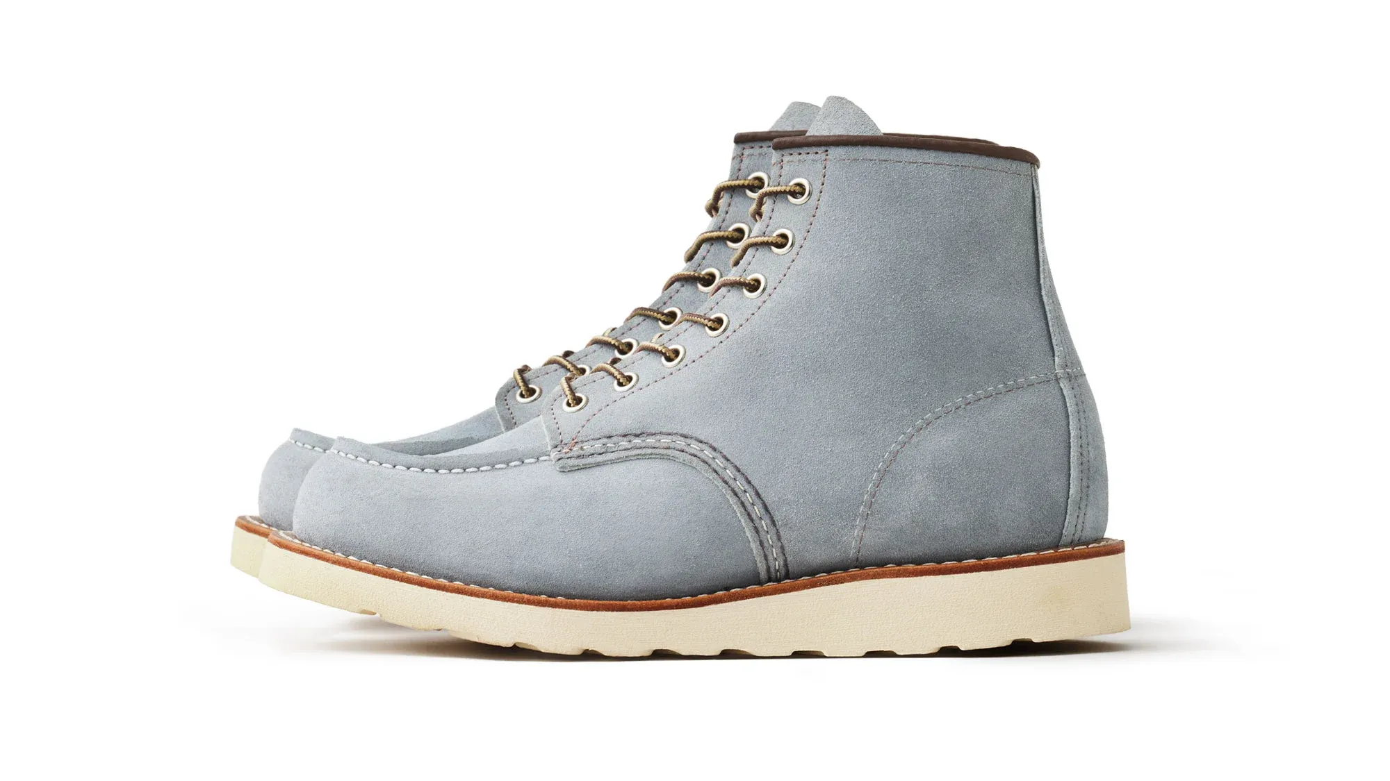Pale blue suede moc toe boot with grey laces and a cream wedge sole