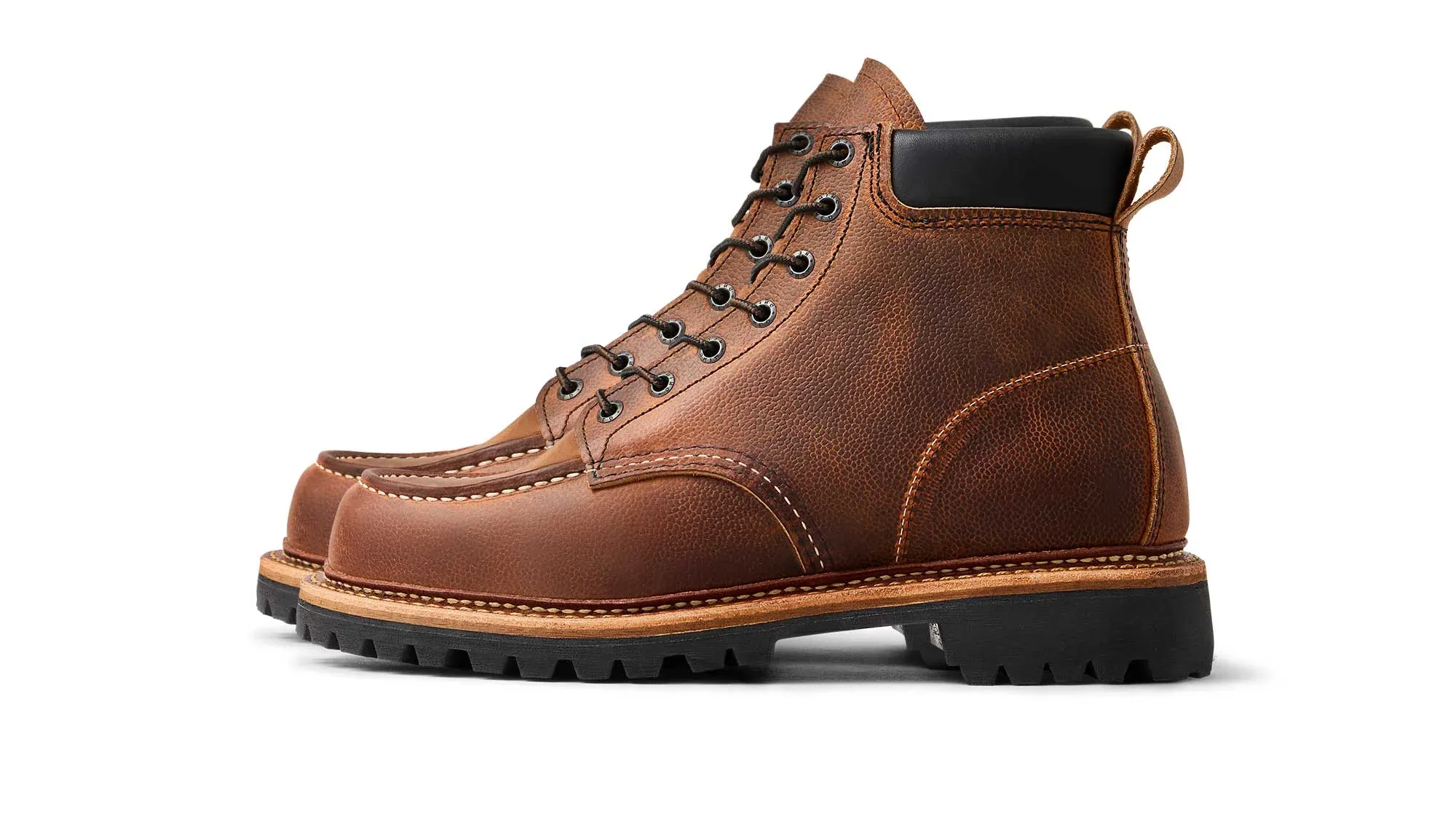Brown leather moc toe boot with a padded black collar and a black lug sole