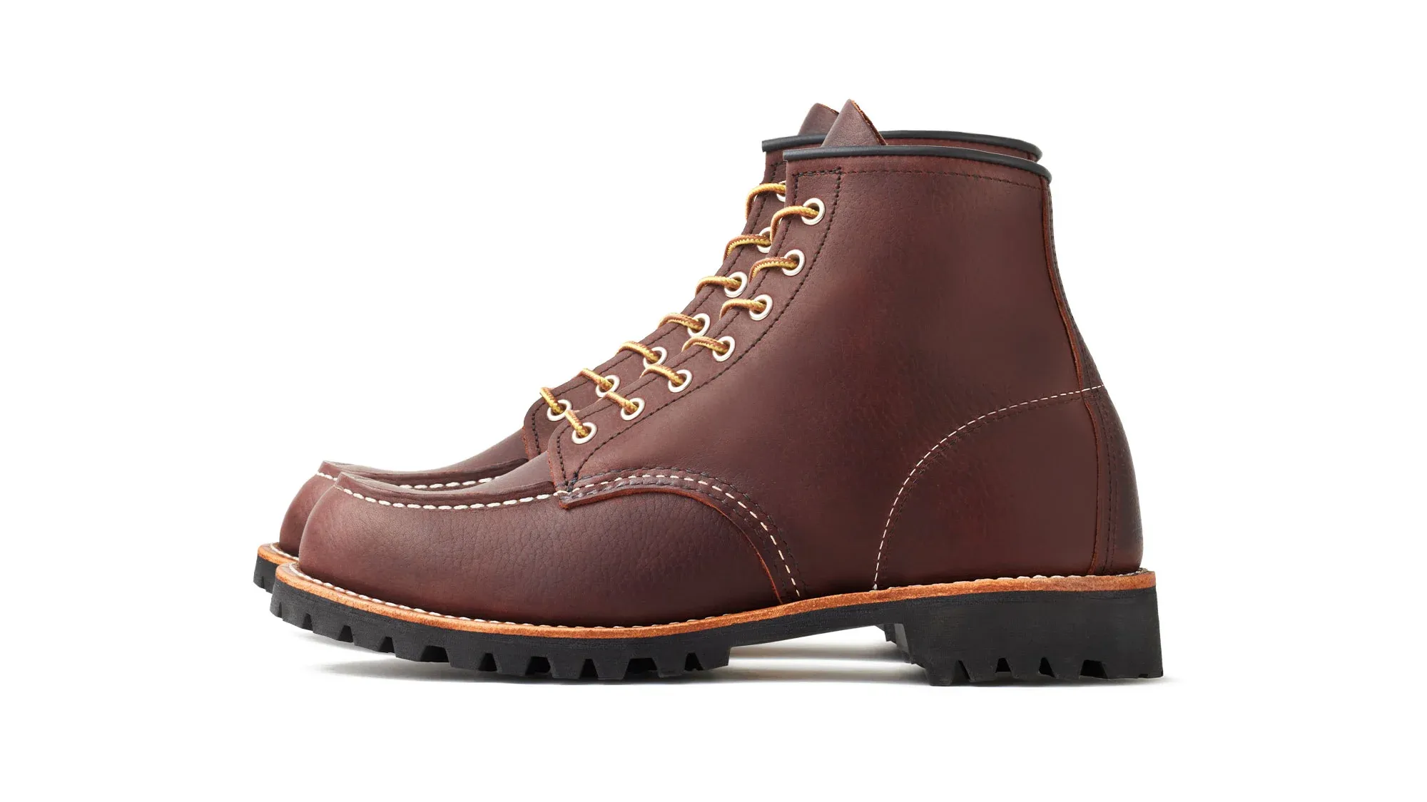 Oxblood leather moc toe boot with tan laces and a black lug sole
